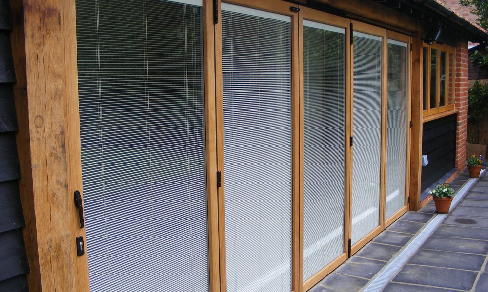 Best-Selling-Windows-blinds-in-glass-wooden-bi-folding-doors