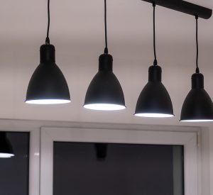 Kitchen light elements, lamps. Black dome lamps. Bright renovated kitchen space. Ceiling Light LED Round Surface.