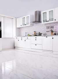 Interior Of Modern White Clean Kitchen With Microwave Oven And Refrigerator